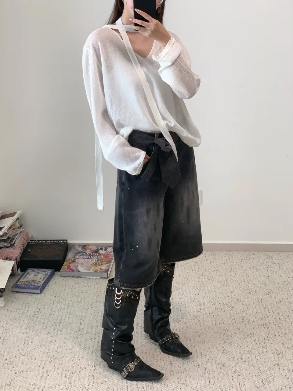 Ribbon tie top styled with black denim Bermuda shorts