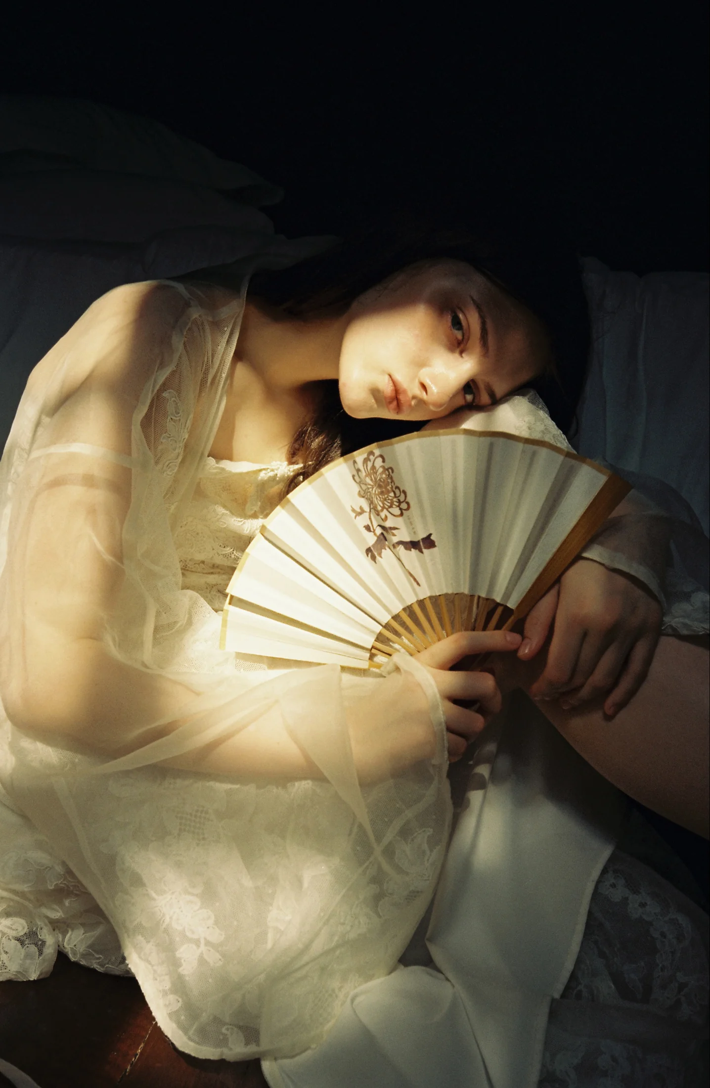 Lookslulu sheer dress styled with a folding fan